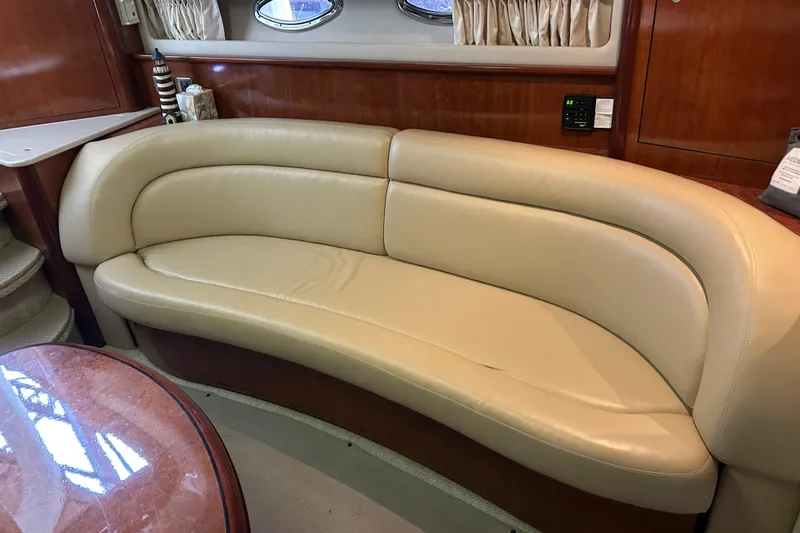 Slide: The Image of Luxurious beige leather seating in 2004 Sea Ray 420 Sundancer yacht interior. - 20