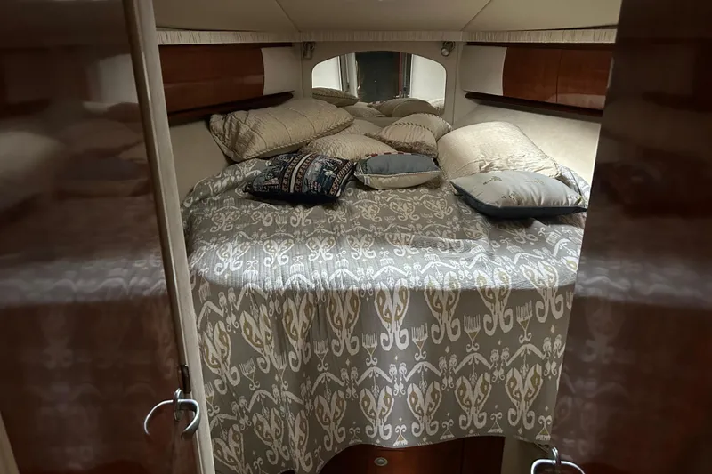 Slide: The Image of Luxurious cabin interior of 2004 Sea Ray 420 Sundancer yacht with elegant bedding. - 21