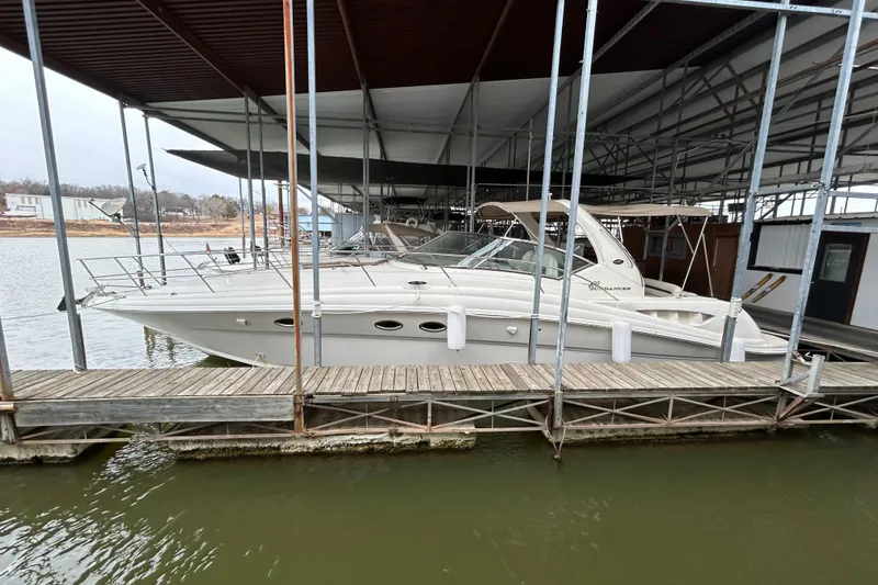 Slide: The Image of 2004 Sea Ray 420 Sundancer docked in a covered marina slip. - 5