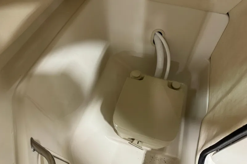 Slide: The Image of 2004 Sea Ray 240 Sundeck boat interior with plumbing fixture. - 13