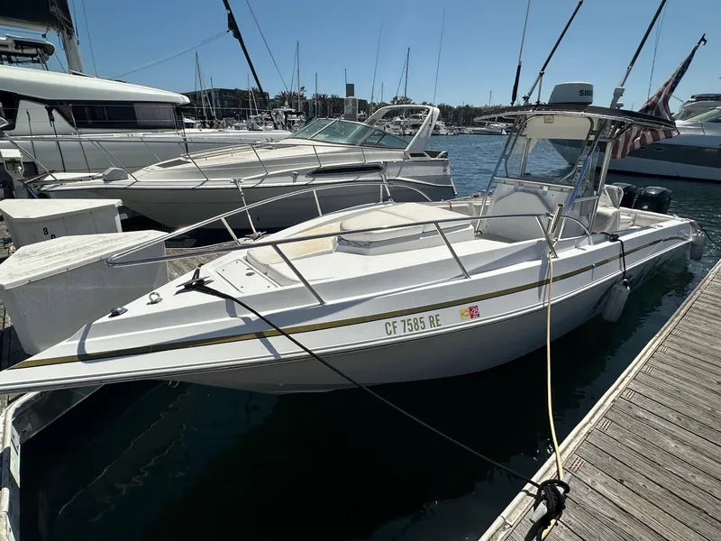 The Image of 2004 Fountain 31 Tournament Edition boat docked at marina, sunny day. - 0