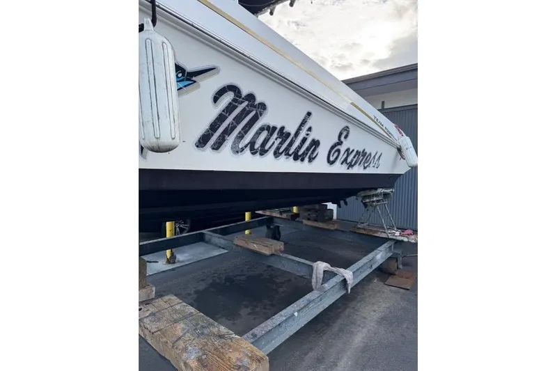 Slide: The Image of 2004 Fountain 31 Tournament Edition boat named "Marlin Express" on a trailer. - 10