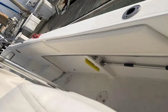 Slide: The Image of 2004 Fountain 31 Tournament Edition boat interior with storage compartments. - 28