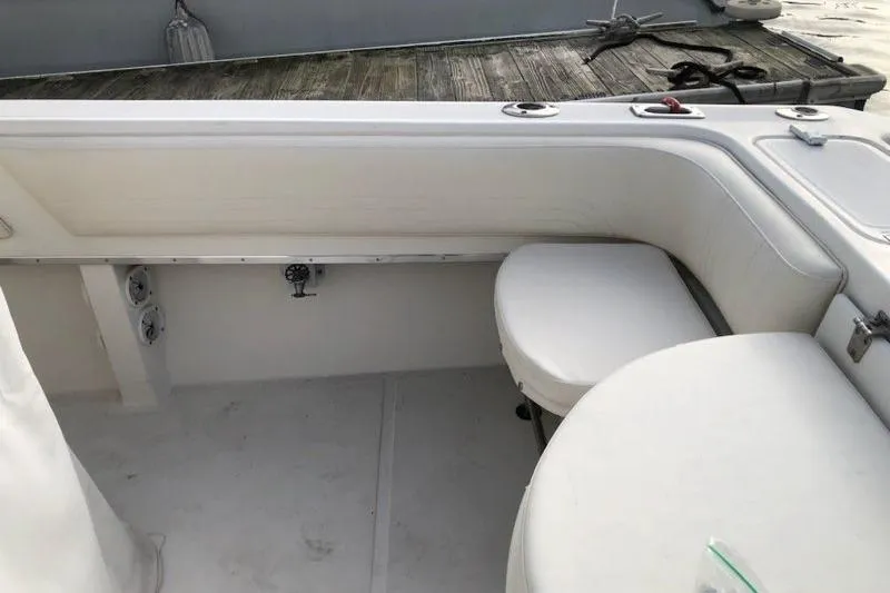 Slide: The Image of 2004 Fountain 31 Tournament Edition boat interior with seating and storage. - 30