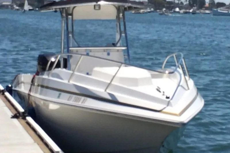 Slide: The Image of 2004 Fountain 31 Tournament Edition boat docked on calm water. - 8