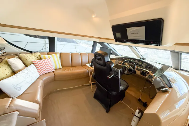 Slide: The Image of Luxurious interior of 2001 Carver 570 Voyager Pilothouse with plush seating and modern helm. - 27