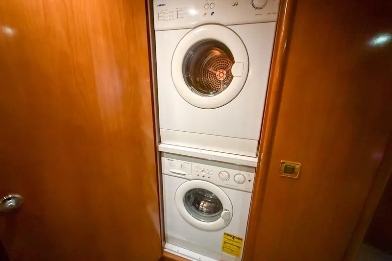 Slide: The Image of Stacked washer and dryer in 2001 Carver 570 Voyager Pilothouse yacht interior. - 35