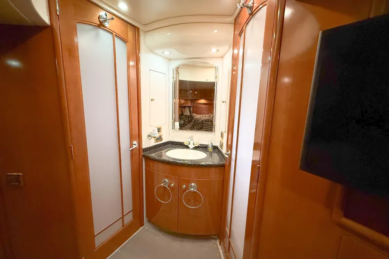 Slide: The Image of Luxurious bathroom interior of 2001 Carver 570 Voyager Pilothouse yacht with wood finishes. - 38