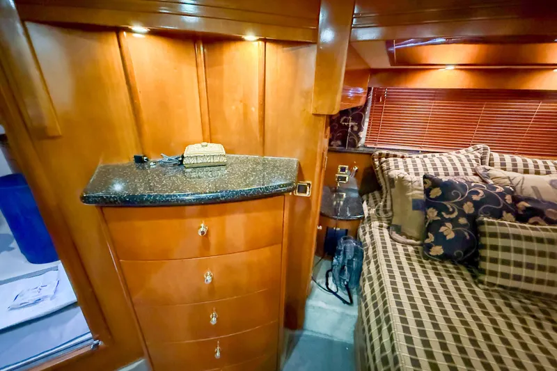Slide: The Image of Luxurious cabin interior of 2001 Carver 570 Voyager Pilothouse with elegant wood finish. - 40