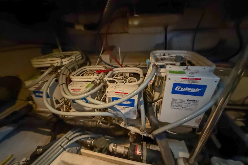 Slide: The Image of Engine room of 2001 Carver 570 Voyager Pilothouse with Cruisair systems. - 41