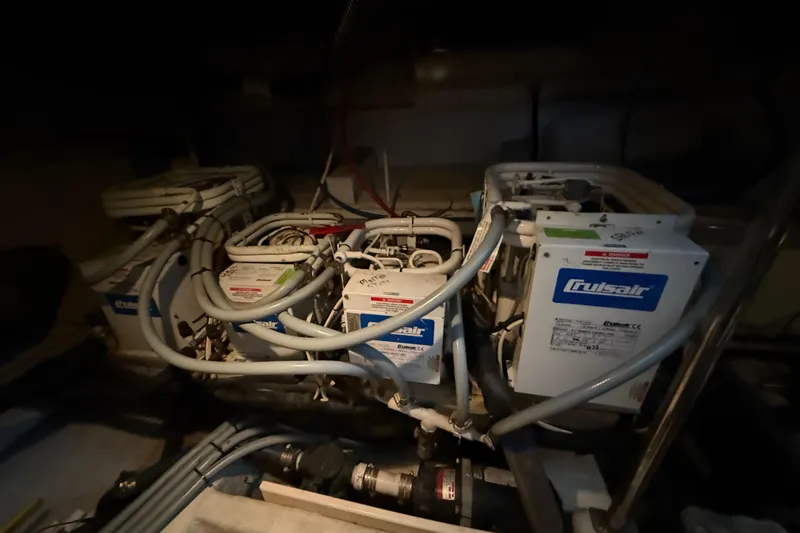 Slide: The Image of Engine room of 2001 Carver 570 Voyager Pilothouse with Cruisair systems. - 50