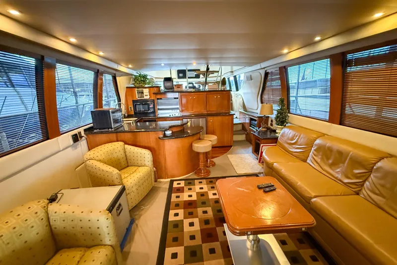 Slide: The Image of Luxurious interior of 2001 Carver 570 Voyager Pilothouse yacht with modern furnishings. - 18