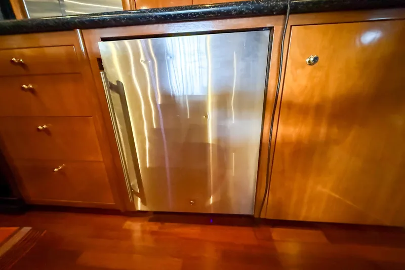 Slide: The Image of Stainless steel refrigerator in 2001 Carver 570 Voyager Pilothouse kitchen. - 24