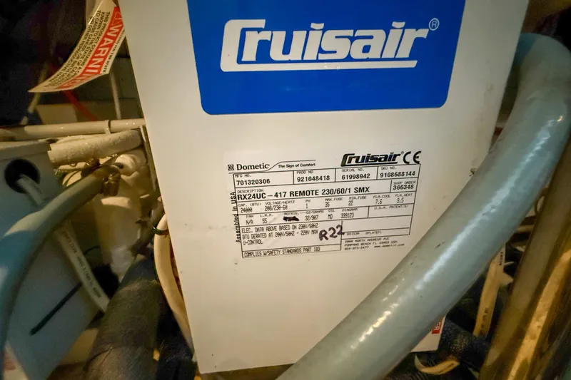 Slide: The Image of Cruisair unit on a 2001 Carver 570 Voyager Pilothouse, featuring technical specifications label. - 42