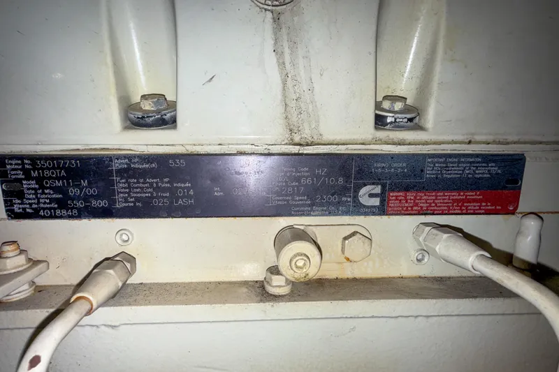 Slide: The Image of Close-up of a Cummins engine label on a 2001 Carver 570 Voyager Pilothouse. - 44