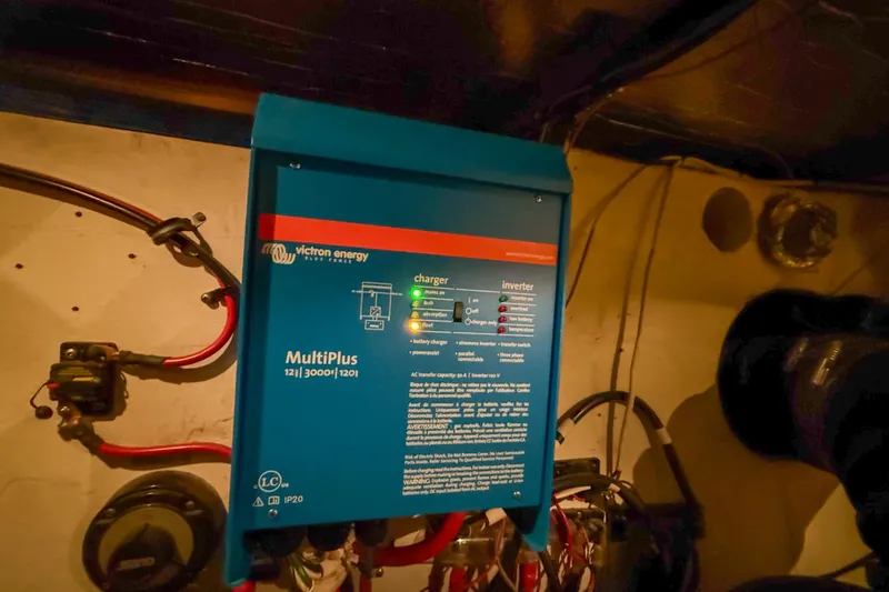 Slide: The Image of Victron Energy MultiPlus inverter in 2001 Carver 570 Voyager Pilothouse engine room. - 48