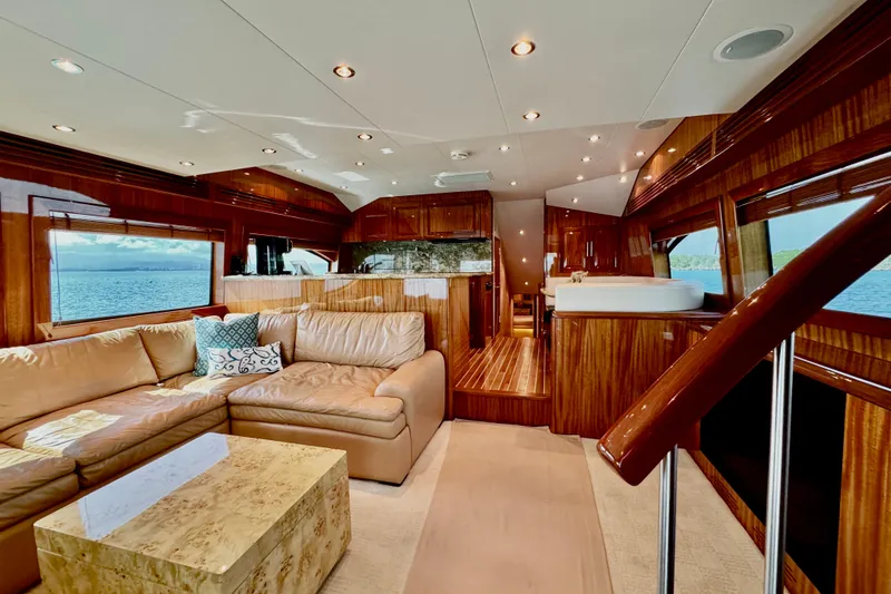 Slide: The Image of Luxurious interior of 2008 Hatteras 64 Convertible yacht with leather seating and wood finishes. - 10