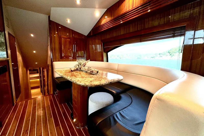 Slide: The Image of Luxurious interior of 2008 Hatteras 64 Convertible yacht with elegant wood finishes. - 12