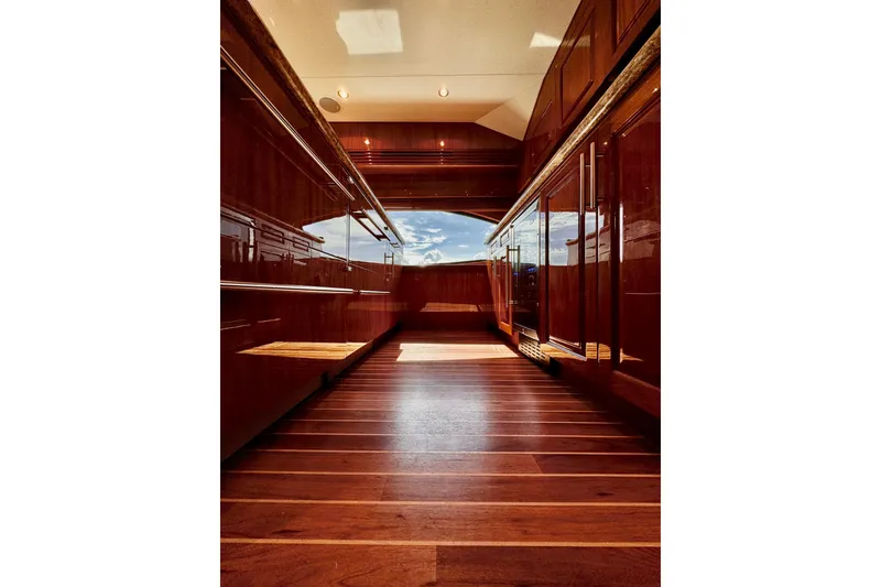 Slide: The Image of Luxurious interior of 2008 Hatteras 64 Convertible yacht with polished wood finishes. - 13