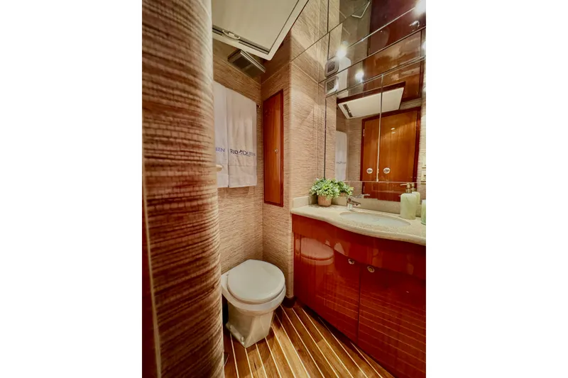 Slide: The Image of Luxurious bathroom in 2008 Hatteras 64 Convertible yacht with elegant wood finishes. - 23