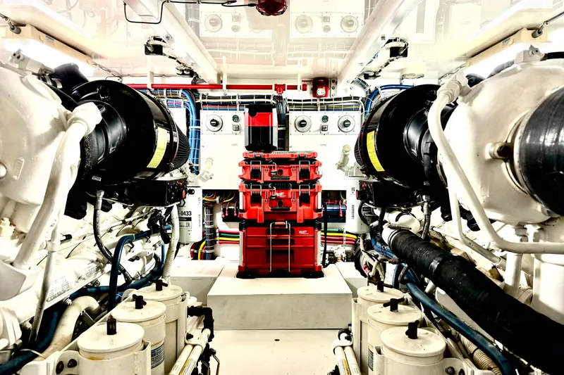 Slide: The Image of Engine room of 2008 Hatteras 64 Convertible yacht, showcasing machinery and equipment. - 24