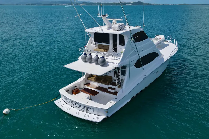 Slide: The Image of 2008 Hatteras 64 Convertible yacht on calm blue waters, rear view. - 3