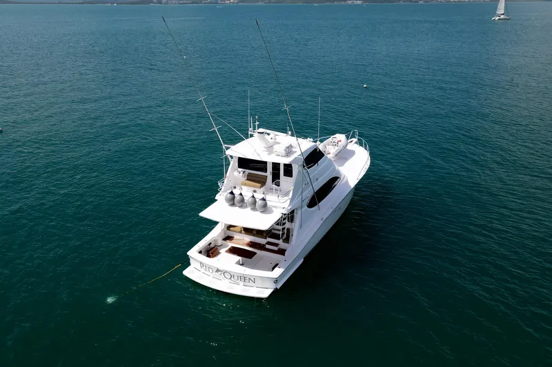 Slide: The Image of 2008 Hatteras 64 Convertible yacht on open water, aerial view. - 4
