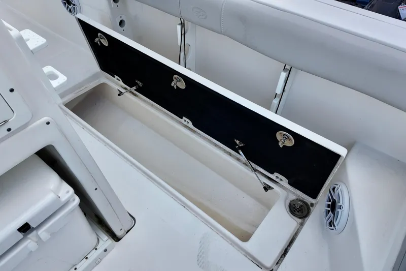 Slide: The Image of 2022 Sea Fox 288 Commander boat storage compartment open, showcasing interior space. - 12