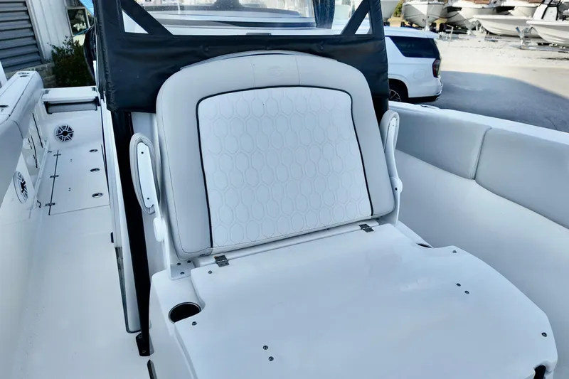 Slide: The Image of 2022 Sea Fox 288 Commander boat interior with white cushioned seating. - 15
