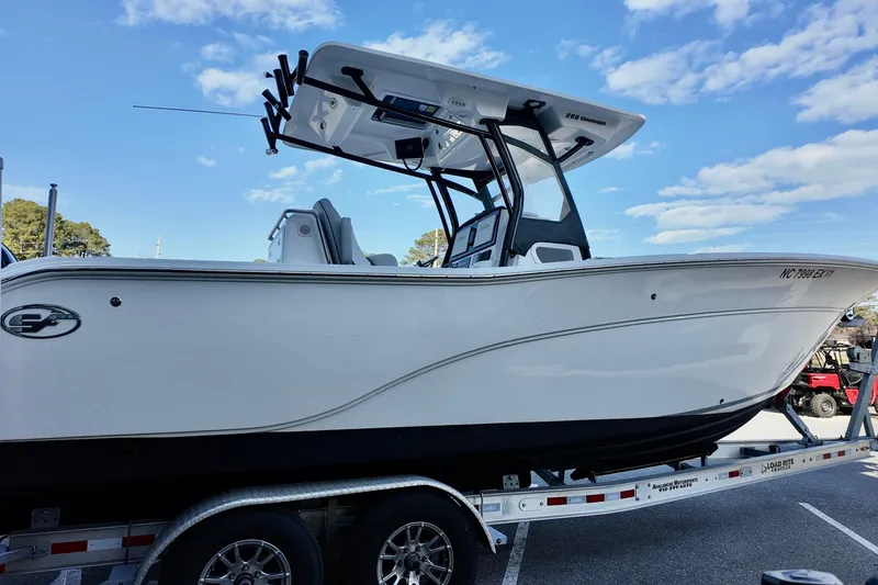 Slide: The Image of 2022 Sea Fox 288 Commander boat on trailer under blue sky. - 4