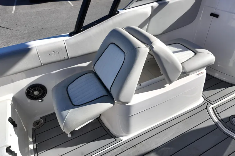 Slide: The Image of 2024 Sea Fox 228 Traveler boat interior with adjustable seating and storage compartment. - 14