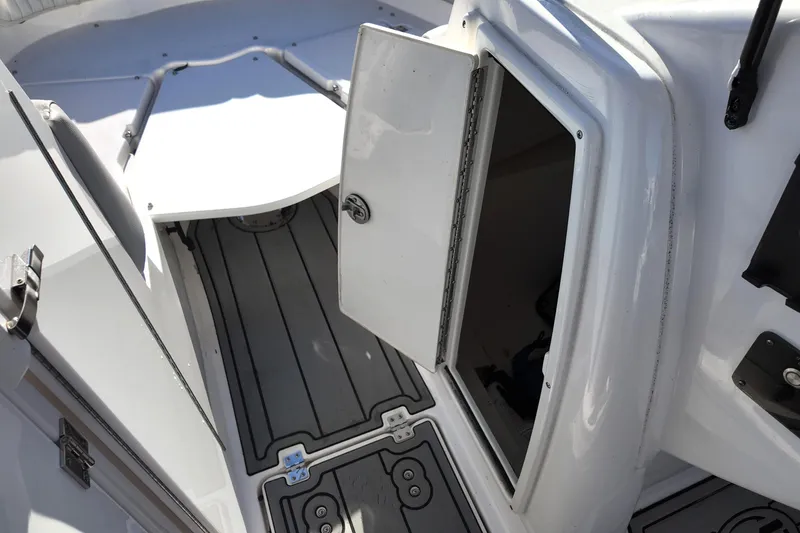 Slide: The Image of 2024 Sea Fox 228 Traveler boat interior with open storage compartment and non-slip flooring. - 15