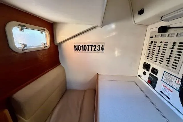 Slide: The Image of Interior of 1999 Caliber 40LRC sailboat with seating and control panel. - 37