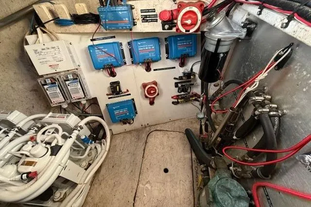 Slide: The Image of Electrical and mechanical systems in a 1999 Caliber 40LRC boat engine room. - 54