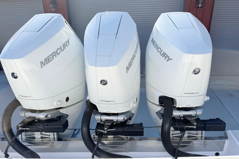 Slide: The Image of Triple Mercury Verado engines on a 2023 Sportsman Open 352 Center Console boat. - 22