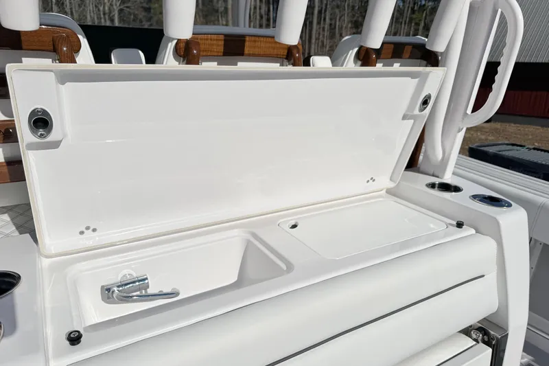 Slide: The Image of 2023 Sportsman Open 352 Center Console boat sink and storage compartment. - 23