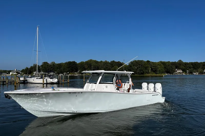 Slide: The Image of 2023 Sportsman Open 352 Center Console boat cruising on a sunny day. - 29