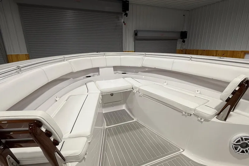 Slide: The Image of 2023 Sportsman Open 352 Center Console interior with white seating and wood accents. - 4