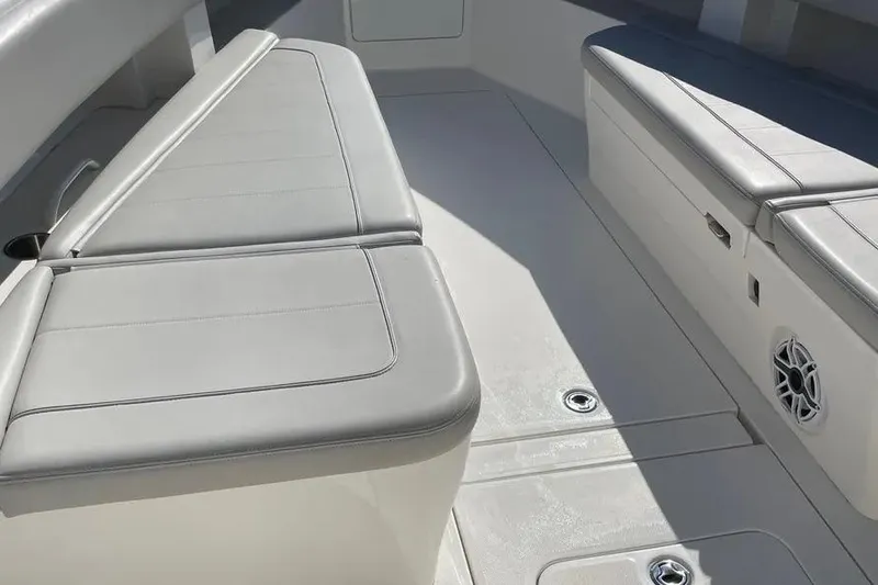 Slide: The Image of 2023 SeaVee 390Z boat interior with cushioned seating and speaker. - 10