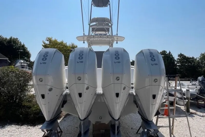 Slide: The Image of 2023 SeaVee 390Z boat with four powerful 300 V8 engines, docked outdoors. - 14