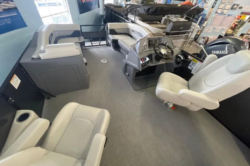 Slide: The Image of Interior of 2026 Starcraft VX 22 Q DH boat with modern seating and steering console. - 5