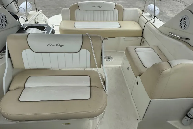 Slide: The Image of 2013 Sea Ray Sundancer 310 interior with beige and white seating arrangement. - 13