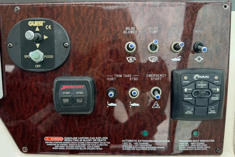 Slide: The Image of Control panel of a 2013 Sea Ray Sundancer 310 boat with various switches and indicators. - 19