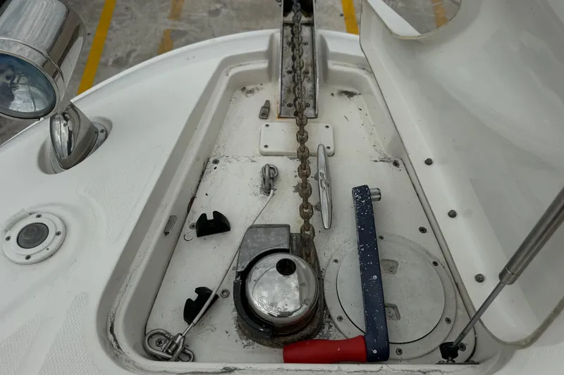 Slide: The Image of Anchor compartment of 2013 Sea Ray Sundancer 310 with chain and winch. - 27