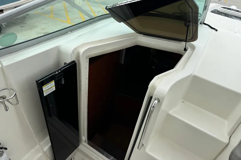 Slide: The Image of 2013 Sea Ray Sundancer 310 cabin entrance with open hatch and steps. - 30