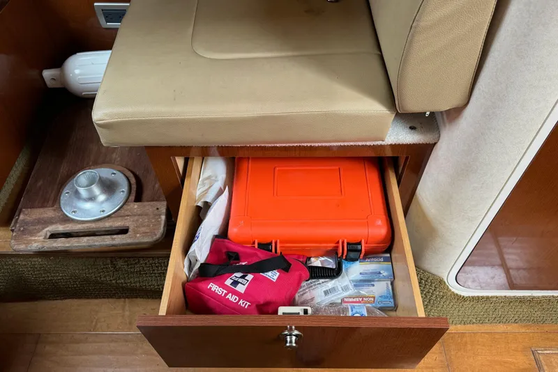 Slide: The Image of Drawer with first aid kit and supplies on 2013 Sea Ray Sundancer 310 boat. - 39
