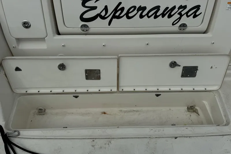 Slide: The Image of 2013 Sea Ray Sundancer 310 boat storage compartment labeled "Esperanza." - 6