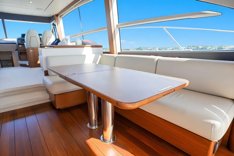 Slide: The Image of Luxurious interior of 2022 Princess F62 yacht with elegant seating and wooden table. - 21