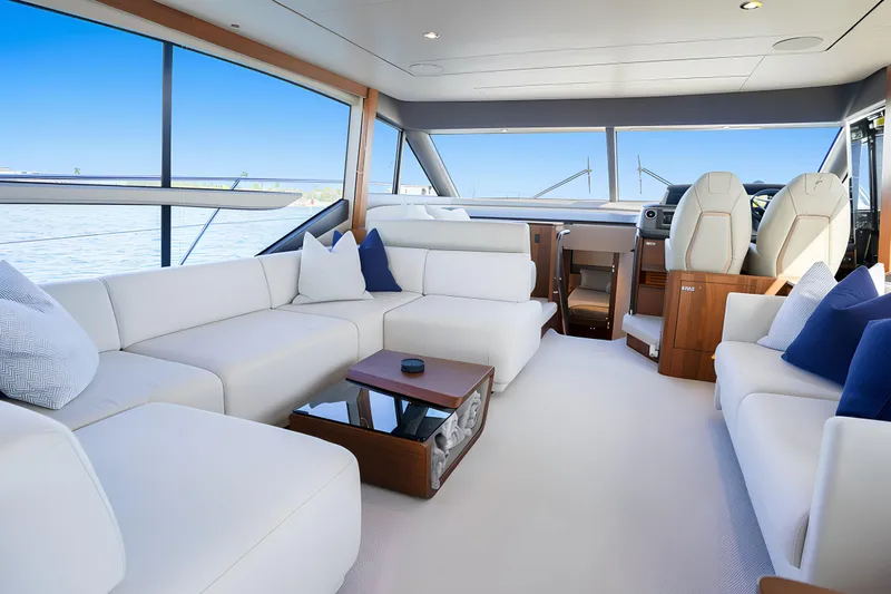 Slide: The Image of Luxurious interior of 2022 Princess F62 yacht with elegant seating and panoramic windows. - 23