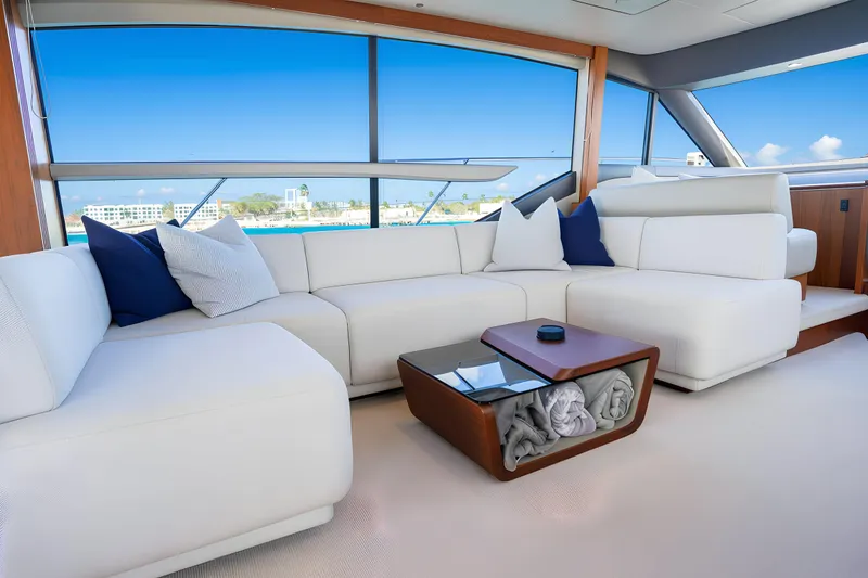 Slide: The Image of Luxurious interior of 2022 Princess F62 yacht with white seating and ocean view. - 24